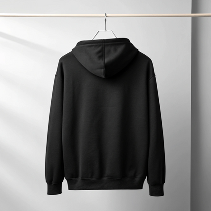 Plain black 450 GSM heavyweight hoodie hanging on a hanger, viewed from the back